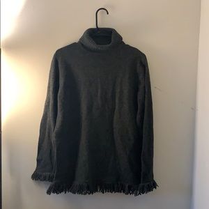 Lambswool turtleneck with fringe